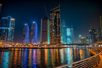 DUBAI, UAE - DECEMBER 6, 2016: Dubai Marina at night. city promenade. Skyscrapers along the canals