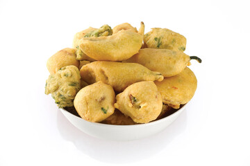 Indian Street Fried Food Pakora Also Know as Pakoda, Bhajiya, Bhajia, Methi Gota, Kanda Bhaji, Pyaz Pakoda, Fried Chillies, Onion Wada, potato vada, aloo Bhajji or fritter, Served with Chutney.