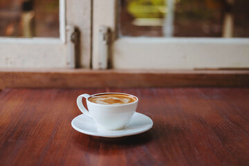 .Coffee cups on a wooden table in a coffee shop