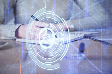 Double exposure of writing hand on background with data technology hologram. Big data concept.