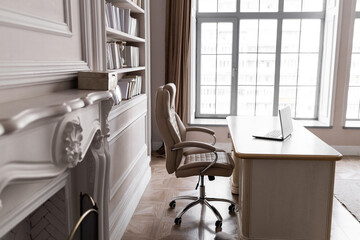 Business interior of personal office. Cosy interior of business room with rolling chair, big windows. Woman office concept.