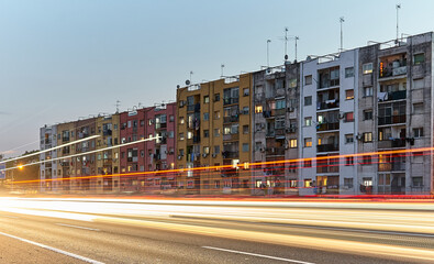 Building facade behind the highway during night time in Cerdanyola del Valles, Catalunya, Spain