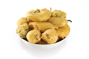 Indian Street Fried Food Pakora Also Know as Pakoda, Bhajiya, Bhajia, Methi Gota, Kanda Bhaji, Pyaz Pakoda, Fried Chillies, Onion Wada, potato vada, aloo Bhaji or fritter, Served with Chutney.
