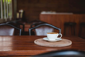 .Coffee cups on a wooden table in a coffee shop