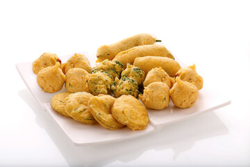 Indian Street Fried Food Pakora Also Know as Pakoda, Bhajiya, Bhajia, Methi Gota, Kanda Bhaji, Pyaz Pakoda, Fried Chillies, Onion Wada, potato vada, aloo Bhaji or fritter, Served with Chutney.