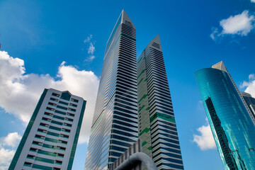 Fototapeta premium DUBAI, UAE - DECEMBER 10, 2016: Downtown city skyscrapers on a beautiful sunny day