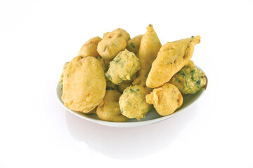 Indian Street Fried Food Pakora Also Know as Pakoda, Bhajiya, Bhajia, Methi Gota, Kanda Bhaji, Pyaz Pakoda, Fried Chillies, Onion Wada, potato vada, aloo Bhaji or fritter, Served with Chutney.