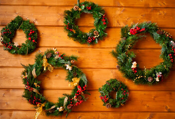 Fototapeta na wymiar Christmas five wreaths on the wooden background