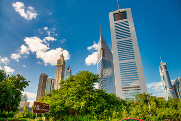 Obraz premium DUBAI, UAE - DECEMBER 10, 2016: Downtown city skyscrapers on a beautiful sunny day