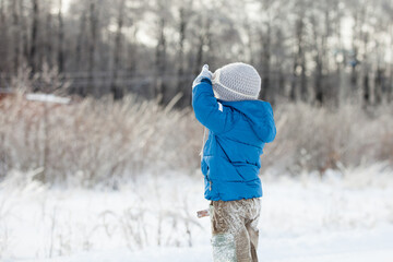 the boy looks into the distance winter