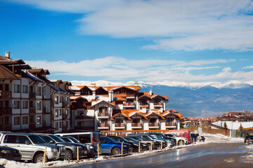 Fototapeta na wymiar houses and snow mountains landscape panorama in bulgarian ski resort Bansko, Bulgaria