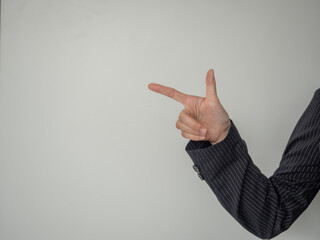 hand of business man, finger point at side of white background. business advertising copy-space