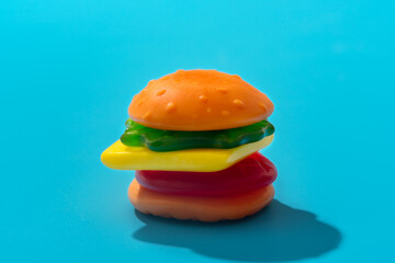 Toy hamburger fast food pattern on blue background