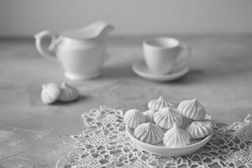 Meringue with a mug of milk, selective focus, close-up