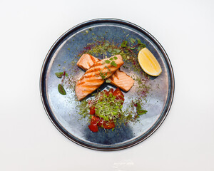 Fish on a plate on a white background