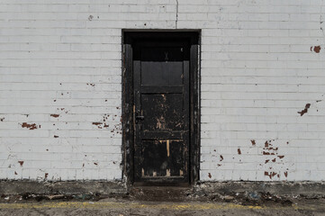 Door in a white brick wall