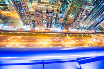 Fototapeta na wymiar DUBAI, UAE - DECEMBER 11, 2016: Night aerial view of Downtown Dubai skyscrapers along Sheikh Zayed Road