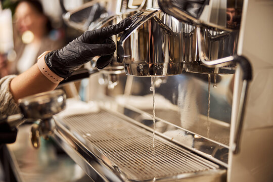 Group head of the modern coffee-machine and water running down