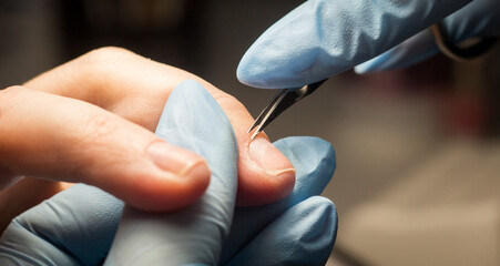 Process of manicure step by step. Instructions for making manicure. Beauty concept. Self-care concept. Close up of female hands. Safe manicure in gloves. Image for sites about beauty sphere