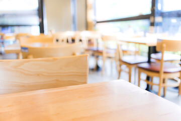 Modern interior of coffee shop with selective focusing  on wooden top table for montage product display