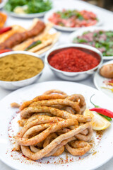 Mumbar, Traditional Turkish Stuffed rice into sheep intestines or offal food on the table in Turkish Restaurant. Mumbar Dolma is the favorite food Adana city of Turkey. 