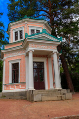 Fototapeta na wymiar Pink Pavilion on island of Anti-Circe (island of love) in Sofiyivka park in Uman, Ukraine