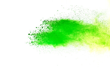 Freeze motion of green color powder exploding on white background.
