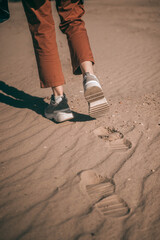 girl's feet on the sand