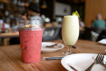 strawberry smoothie on wooden table in restuarant