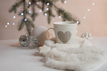 Obraz na płótnie Canvas Marshmallows, Christmas balls, cookies and white fur on a pink background.