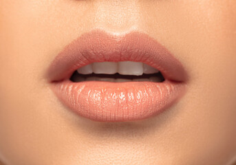 Obraz premium Lips, smile. Close up portrait of beautiful young woman on studio background. Concept of cosmetics, makeup, natural and eco treatment, skin care. Shiny and healthy look, fashion, healthcare. Details.