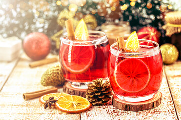 hot winter drink, Christmas wine with cheerful colors and lights. Drink with cinnamon and citrus fruits. Known as mulled wine, Spanish sangria, glogg and glühwein.