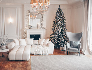 Decorated Christmas tree with gifts in white classic New Year's living room holiday interior