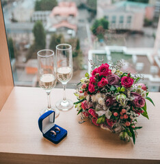 wedding bouquet, wedding rings, champagne glasses