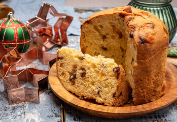 Christmas food, fresh Italian panettone cake made from yeast dough with dried fruits