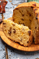 Christmas food, fresh Italian panettone cake made from yeast dough with dried fruits