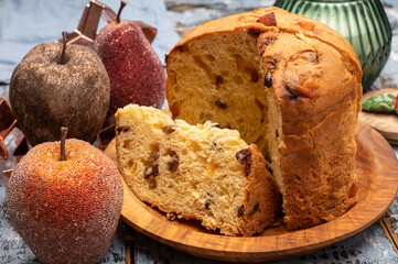Christmas food, fresh Italian panettone cake made from yeast dough with dried fruits