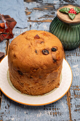 Christmas food, fresh Italian panettone cake made from yeast dough with dried fruits