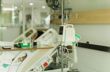Senior patient rest in bed getting her treatment in geriayric hospital.