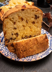 Christmas food, fresh Italian panettone cake made from yeast dough with dried fruits