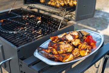 grilled fried pieces of chicken in the backyard of the house