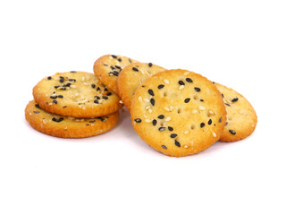 Round sesame crackers isolated on white
