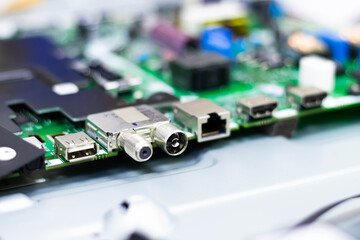 Electronic components. Focus in the enthernet connector. Blur background. Electronic circuit board close up.