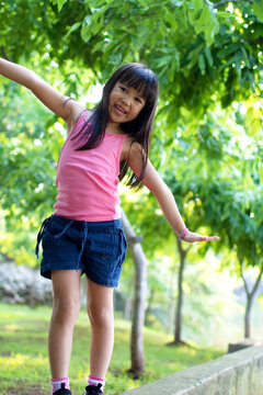 Little Girl Walking Try To Balance