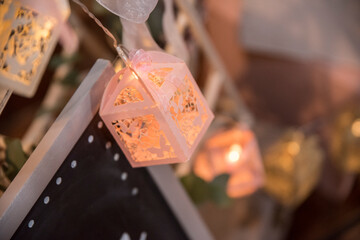 Obraz na płótnie Canvas Wedding decoration. A lantern with light inside. Home decoration