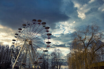 Abandoned Ferris Wheel. Dramatic sky