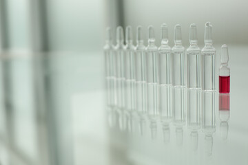 Glass ampoules on a glass table
