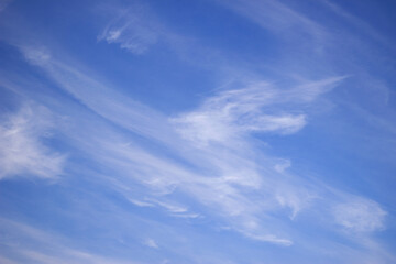 bright blue sky with cloud drawings