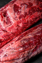 Vertical frame, cuts of raw aged premium marbled beef with plenty of fat for perfect steaks