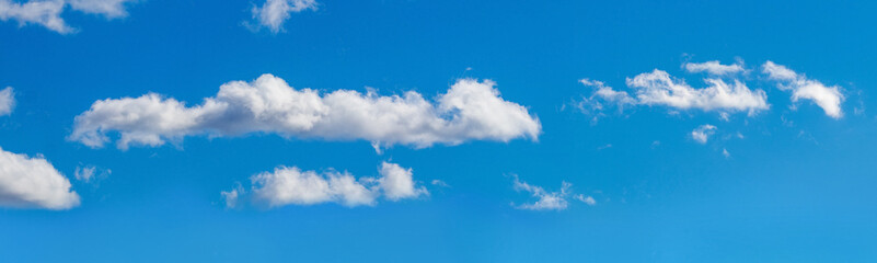 Fototapeta na wymiar Blue sky with white cumulus clouds, sky panorama